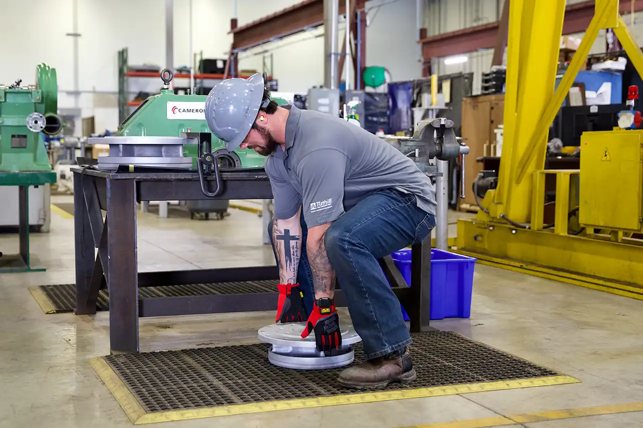 Relevant Industrial employees sharing a safety handshake, symbolizing the company’s culture of accountability, teamwork, and commitment to maintaining a safe and responsible industrial work environment.